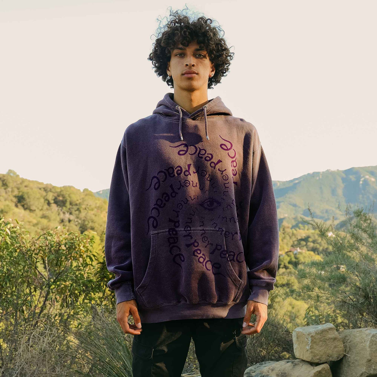 Full front photo with shirt on male model. Altru Inner Peace Dark Purple Hoodie. Garment dyed and washed for soft vintage look and feel,