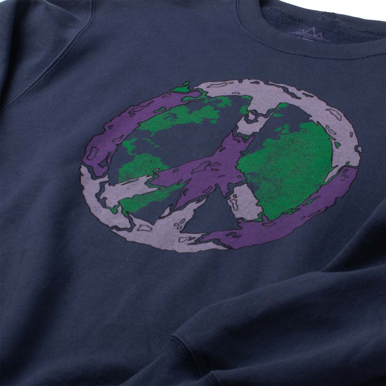 Angled closeup Photo of sweatshirt chest graphic. Peace vibes fleece sweatshirt of Earth covered with the peace sign. Screen printed graphic on front of comfortable navy-blue super soft fleece.