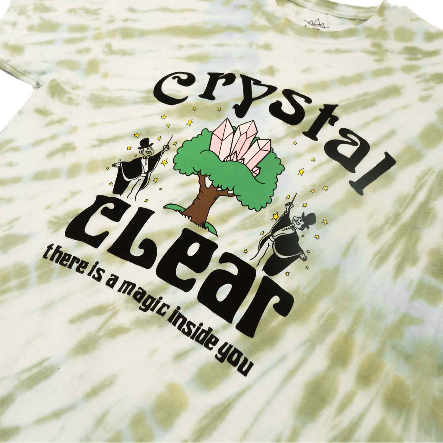 Green and white tie dye with graphic of crystals, tree, magician and motivational text screen printed on front of men's graphic tee. Full front photo.