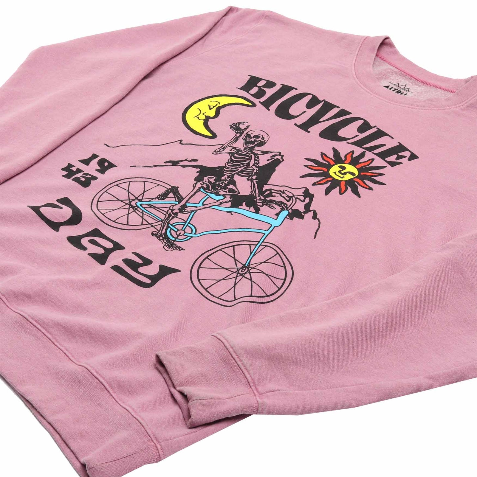up close detail 2 of Altru mens pink fleece sweatshirt with a skeleton riding a bicycle graphic on front and the text "If the doors of perception were cleansed every thing would appear to man as it is, infinite." printed on the back.