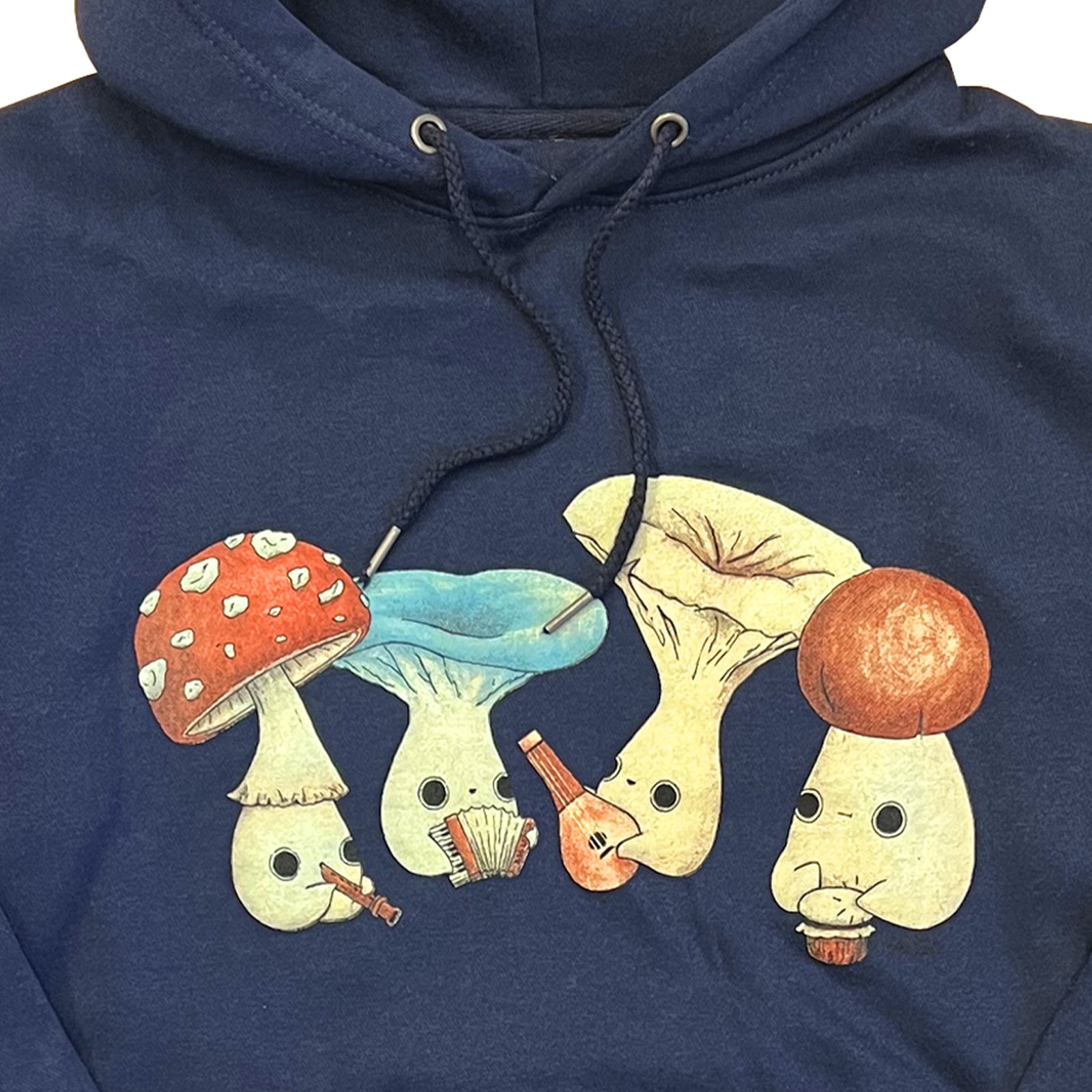 Altru The Fungus Mushlings graphic on front chest playing music on green tee by artist Abi Toads. Navy hoodie front photo close up
