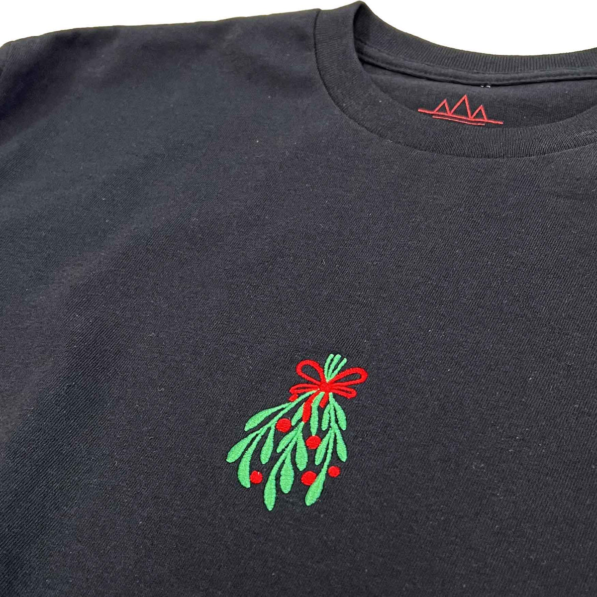 ALTRU MISTLETOE EMBROIDERY BLACK T-SHIRT FRONT CLOSE UP IMAGE