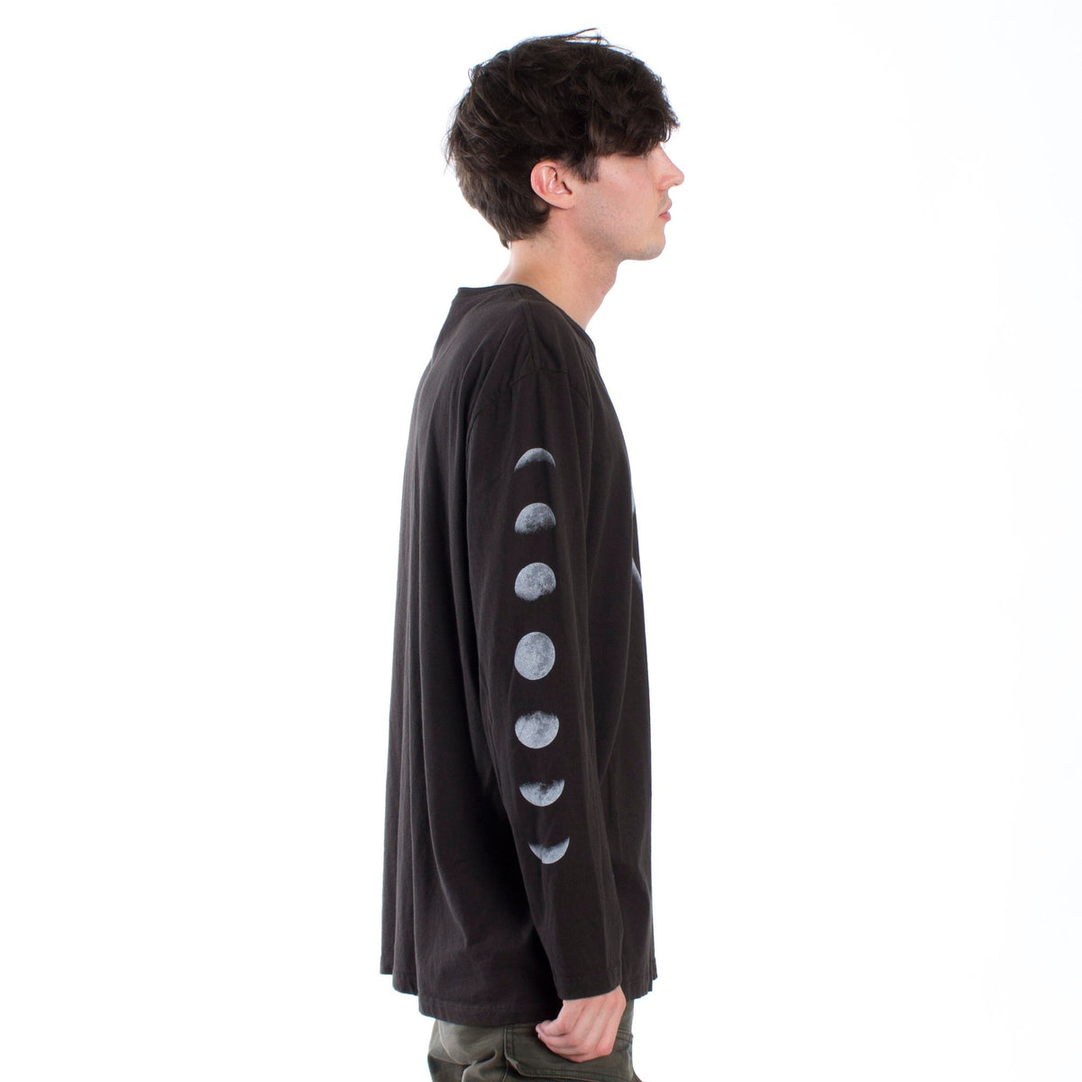 Full front male model side photo right of Lunar graphic phases long sleeve tee printed on both sleeves with a large eclipse graphic on front chest.