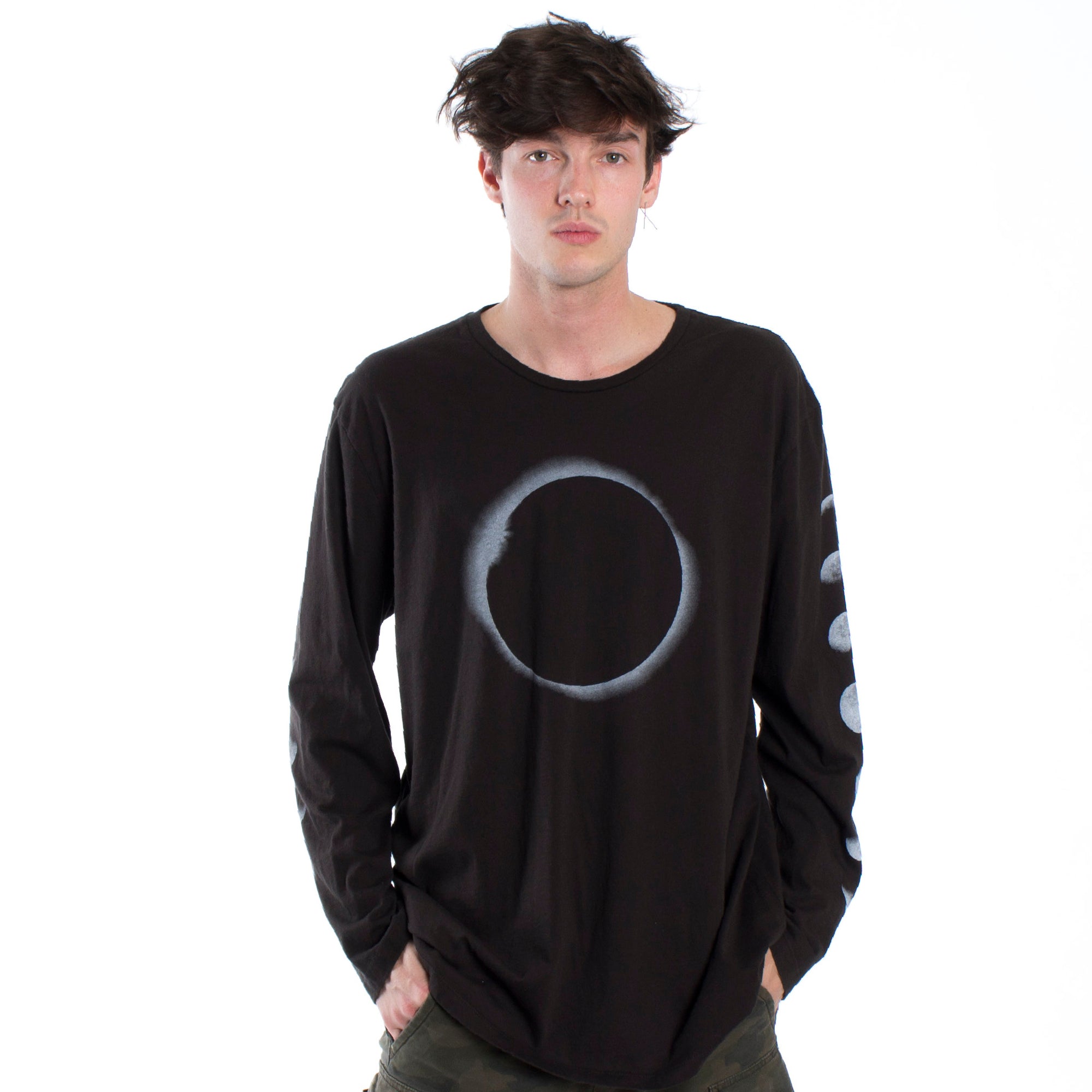 Full front photo of Lunar graphic phases long sleeve tee printed on both sleeves with a large eclipse graphic on front chest.