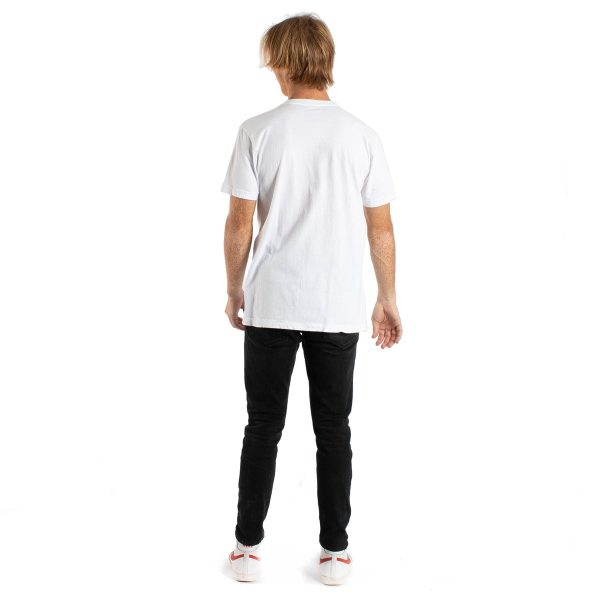 Happy faces graphics in a group on front of white t-shirt on a male model 2nd pose