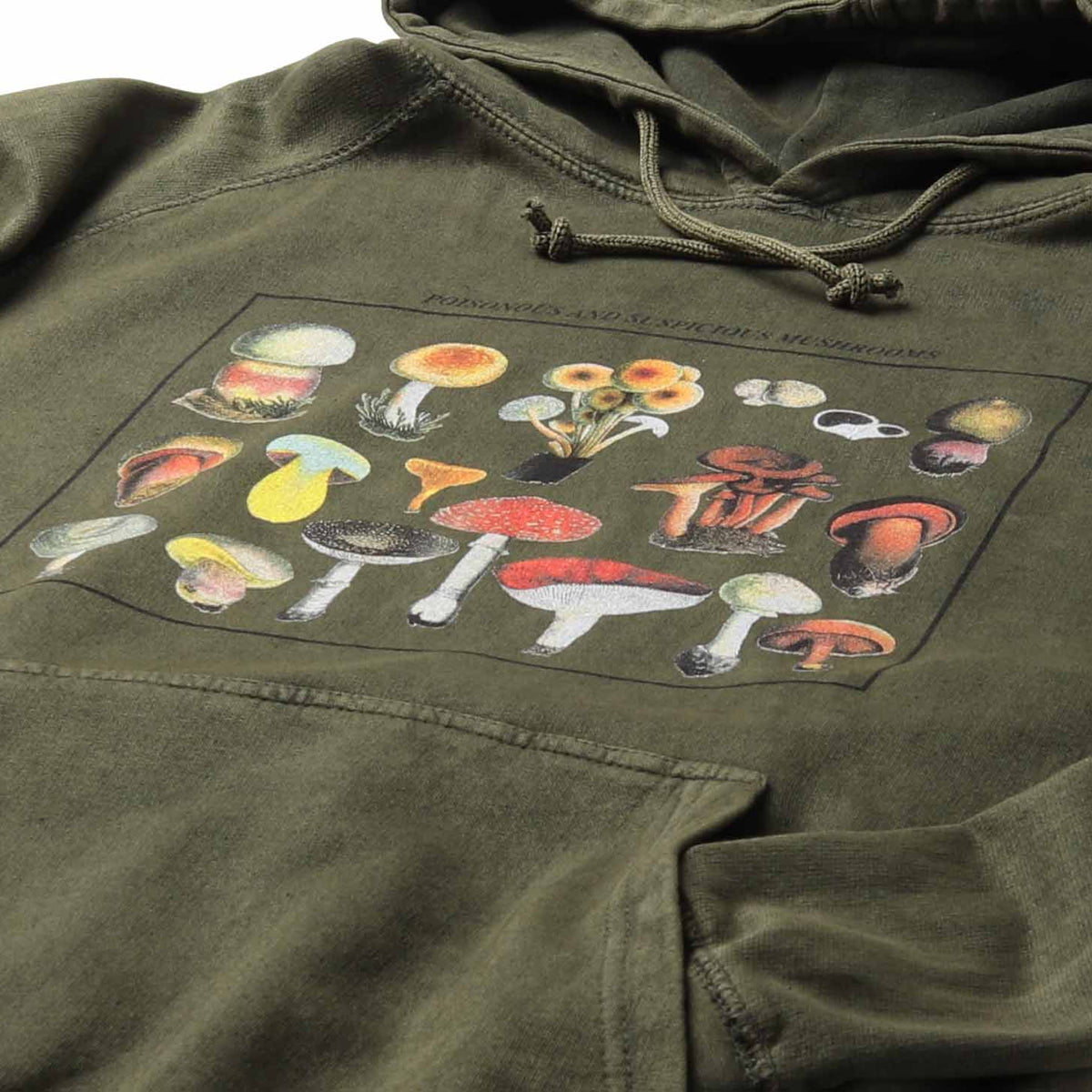 Altru Apparel's Mushroom species graphic screen printed on chest. Pigment dye hoodie processed for a vintage look and feel on a smoke green relaxed fit men's hoodie.  Angled closeup photo of mushroom graphics.