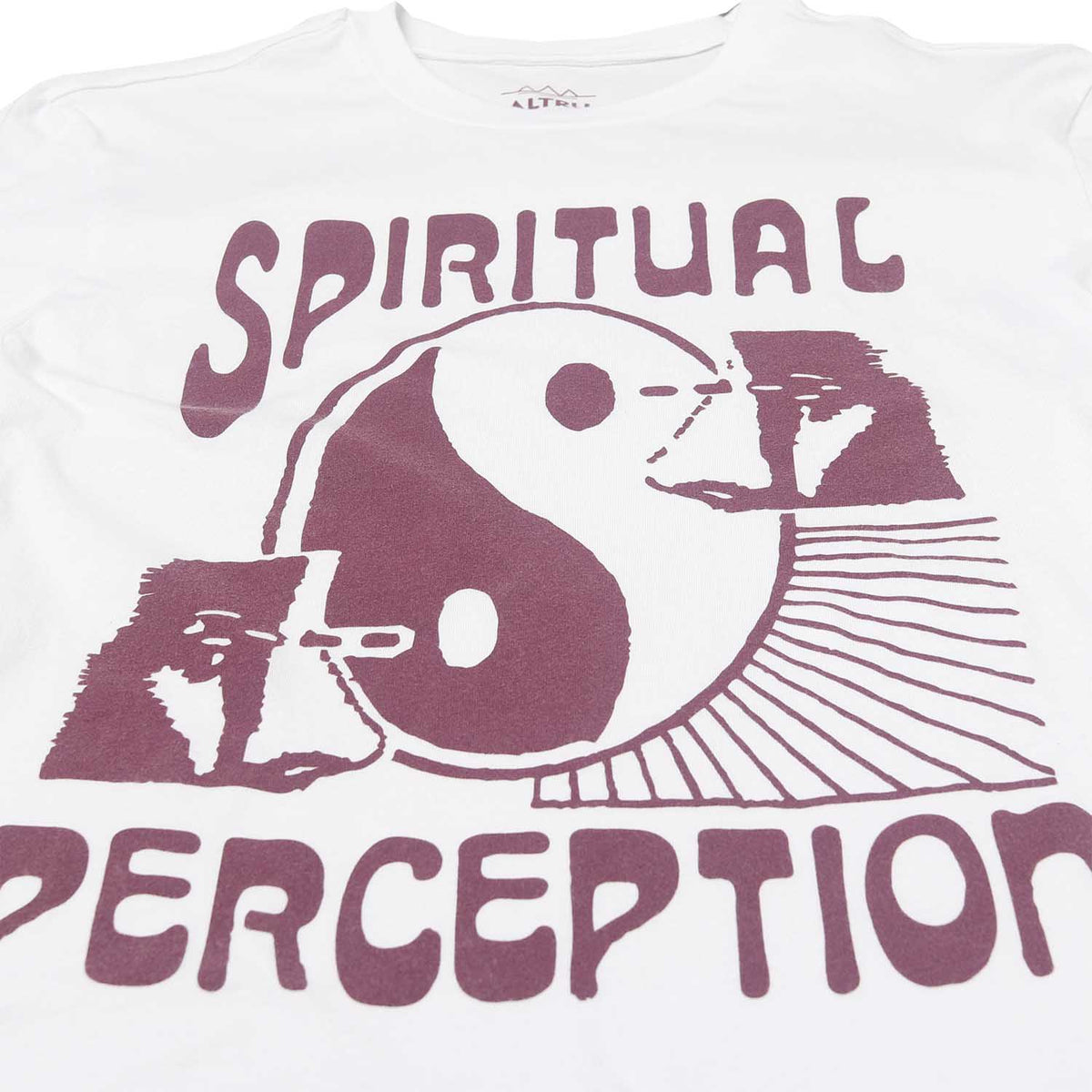 Front detail of white graphic tee with a yin yang symbol and text saying spiritual perception