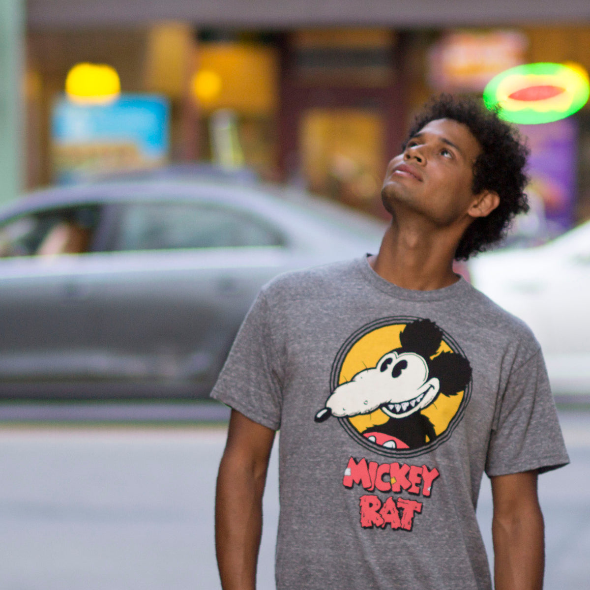 Altru Apparel Mickey Rat classic spotlight pose on grey graphic tee by Robert Armstong. T-shirts photo on male model 3