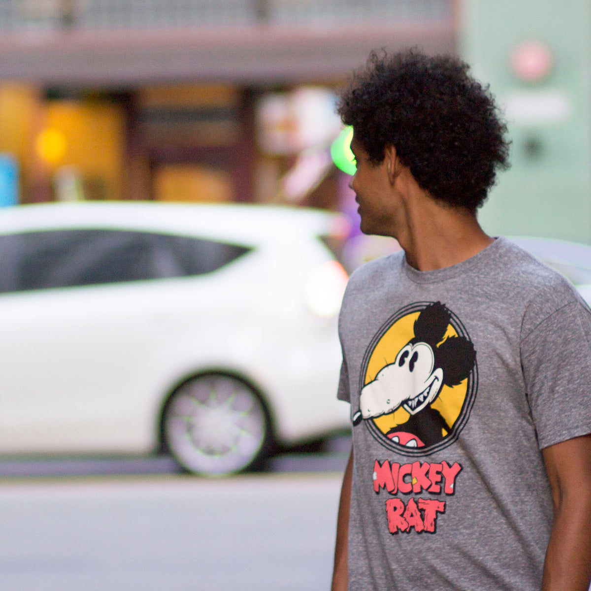 Altru Apparel Mickey Rat classic spotlight pose on grey graphic tee by Robert Armstong. T-shirts photo on male model 2
