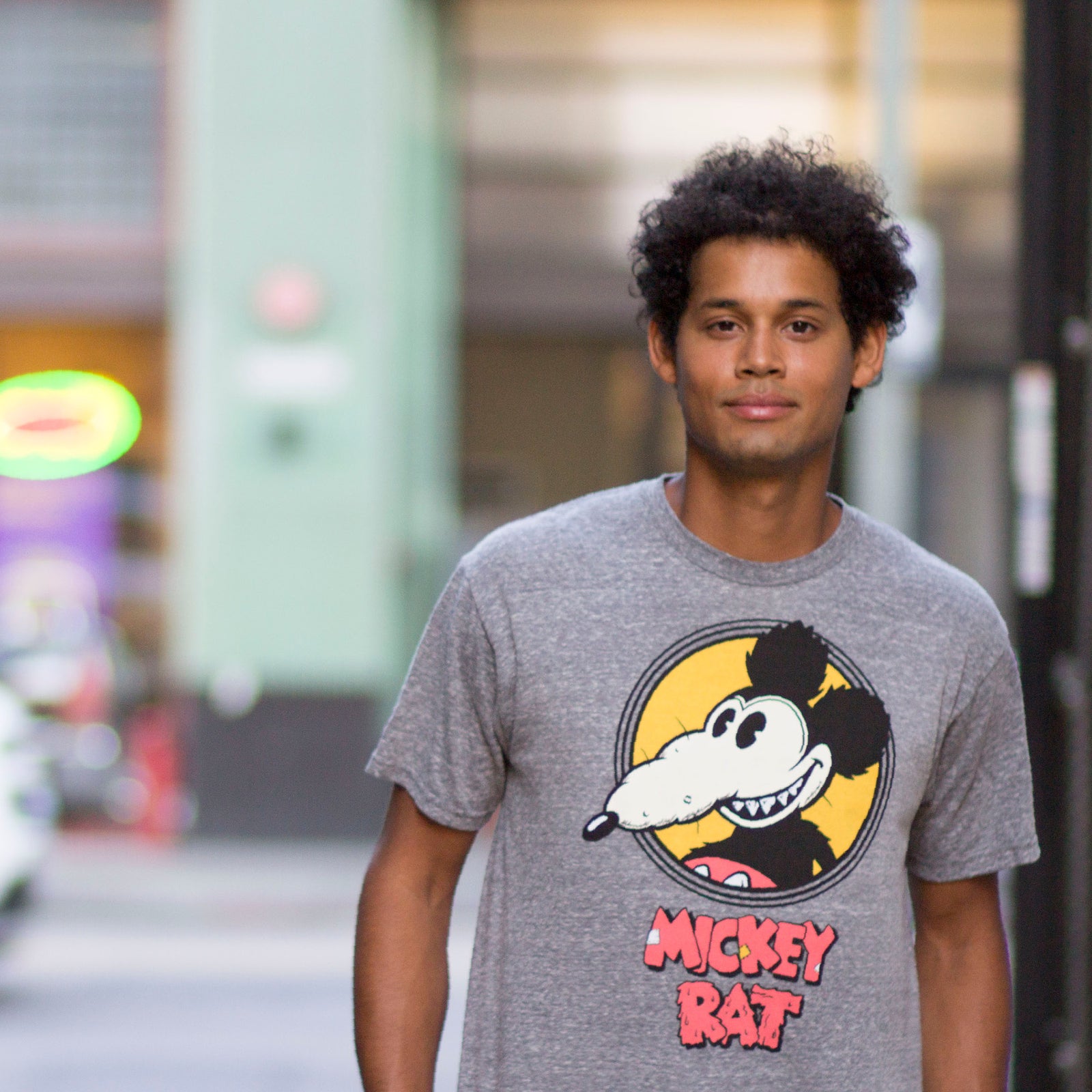 Altru Apparel Mickey Rat classic spotlight pose on grey graphic tee by Robert Armstong. T-shirts photo on male model 1